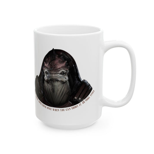 White ceramic mug featuring a graphic of Urdnot Wrex from Mass Effect, with the quote 'Why shoot something once when you can shoot it 46 more times' curved underneath the image. The mug has a glossy finish and a comfortable C-handle