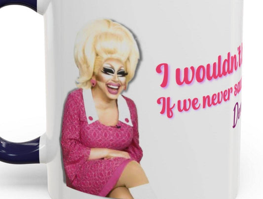 Trixie Mattel and Katya Quote "I wouldn't be surprised if we never see denise richards again" from UNHhhh on a coffee mug with navy blue rim and handle and a picture of trixie on one side and katya on the other