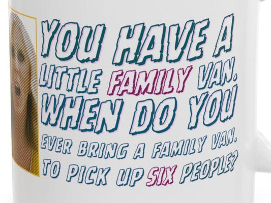 White ceramic mug with a halftone image of a shocked blonde woman and text reading “You have a little family van. When do you ever bring a family van to pick up six people?” in bold blue and pink lettering.