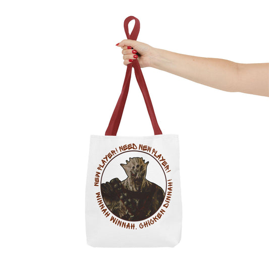 White tote bag with red handles featuring a snarling Vorcha from Mass Effect surrounded by the quotes “NEW PLAYER! NEED NEW PLAYER!” and “WINNAH WINNAH, CHICKEN DINNAH!”