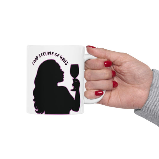 Silhouette of a Darcey from 90 Day Fiancé with long hair holding a wine glass, outlined in pink neon with the phrase “I had a couple of wines” above her head on a white ceramic mug