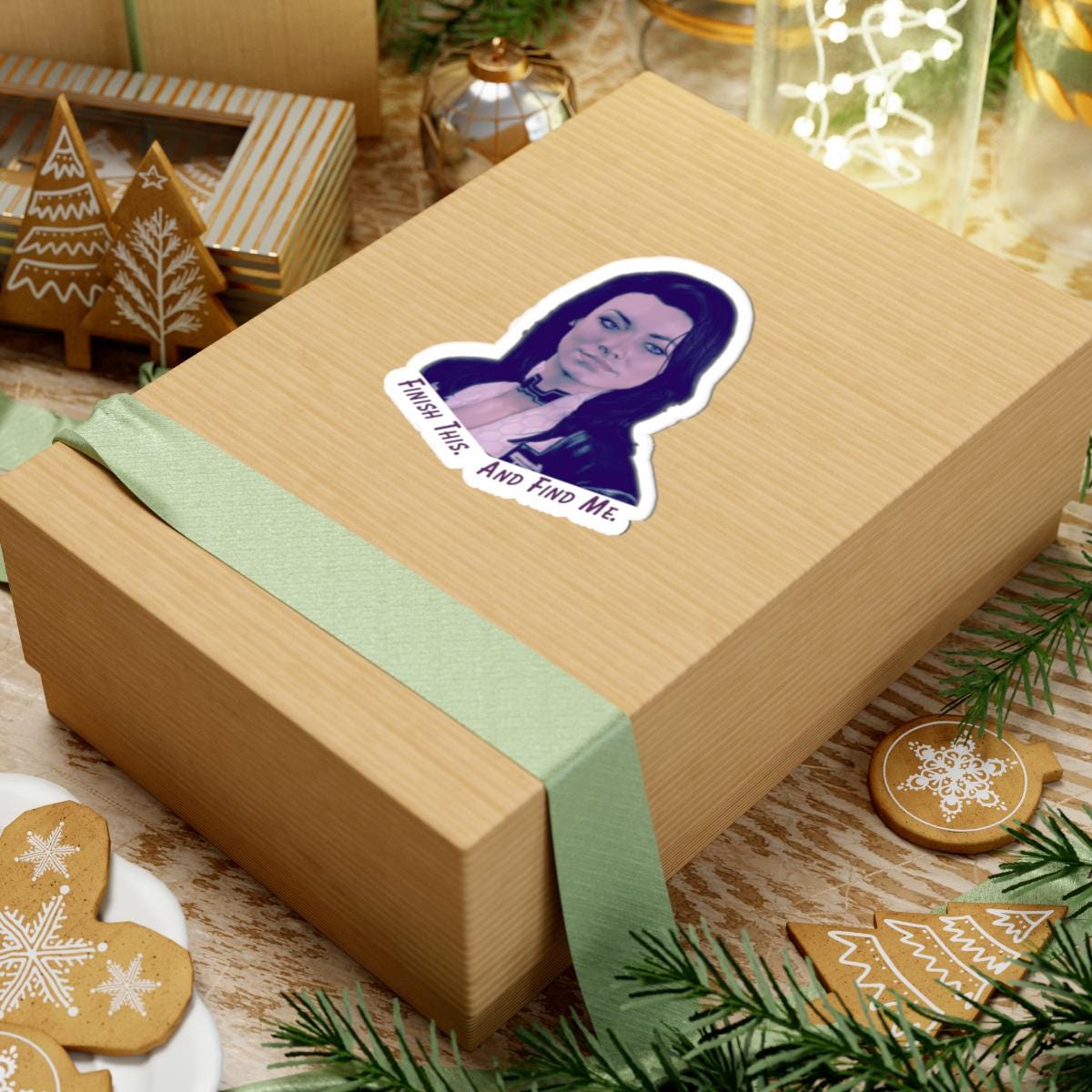 Vinyl sticker of Miranda Lawson from Mass Effect with the quote “Finish this. And find me.” in purple text on a white background.