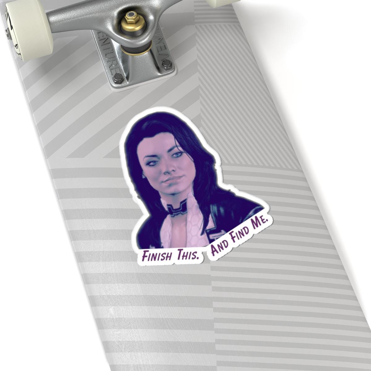 Vinyl sticker of Miranda Lawson from Mass Effect with the quote “Finish this. And find me.” in purple text on a white background.
